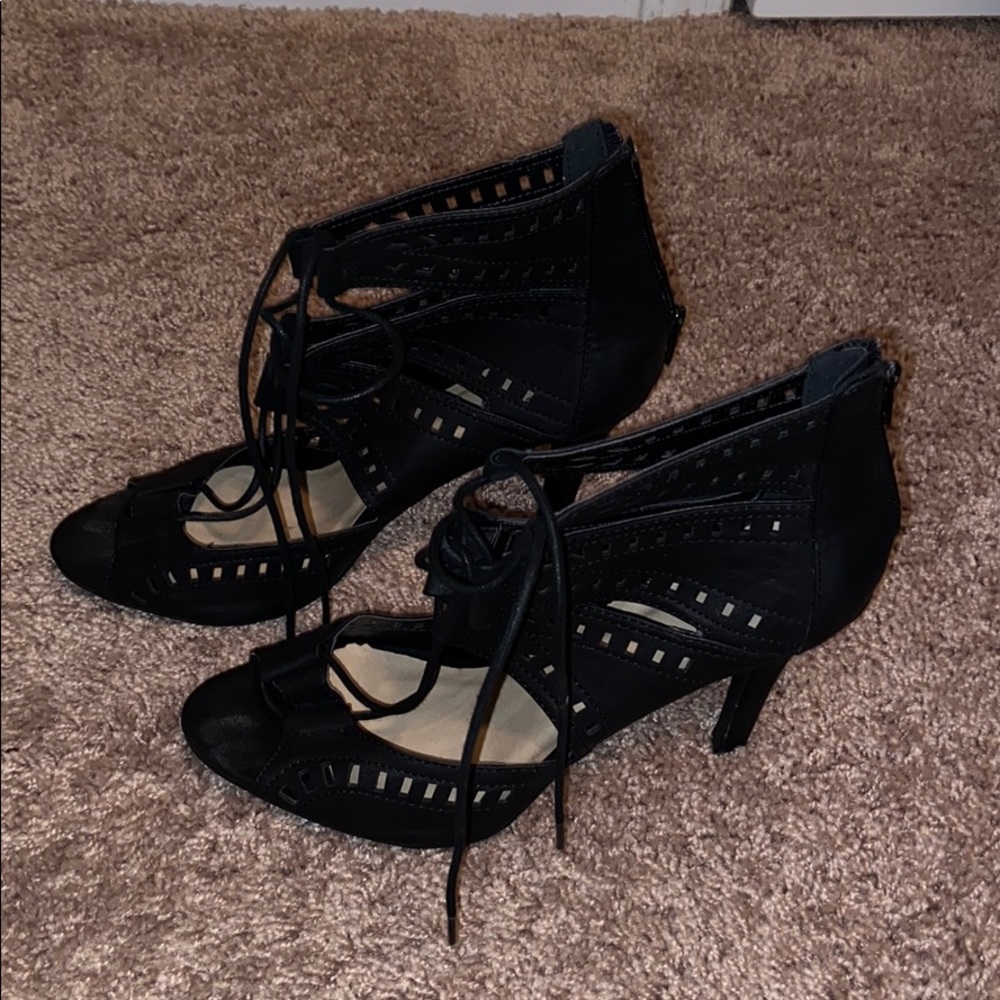 Black tie-up heels.